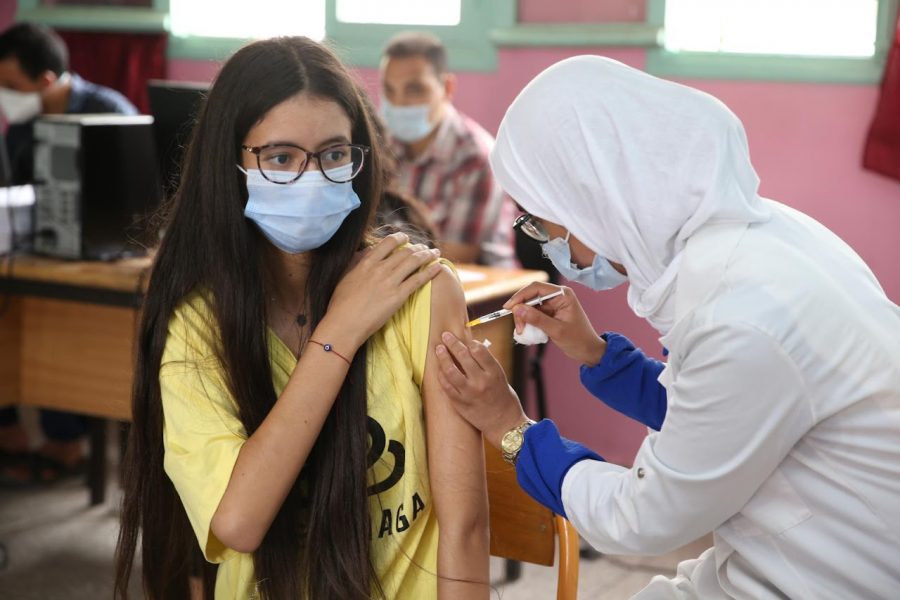 Parents, children rally against a school mandating Covid vaccines on students