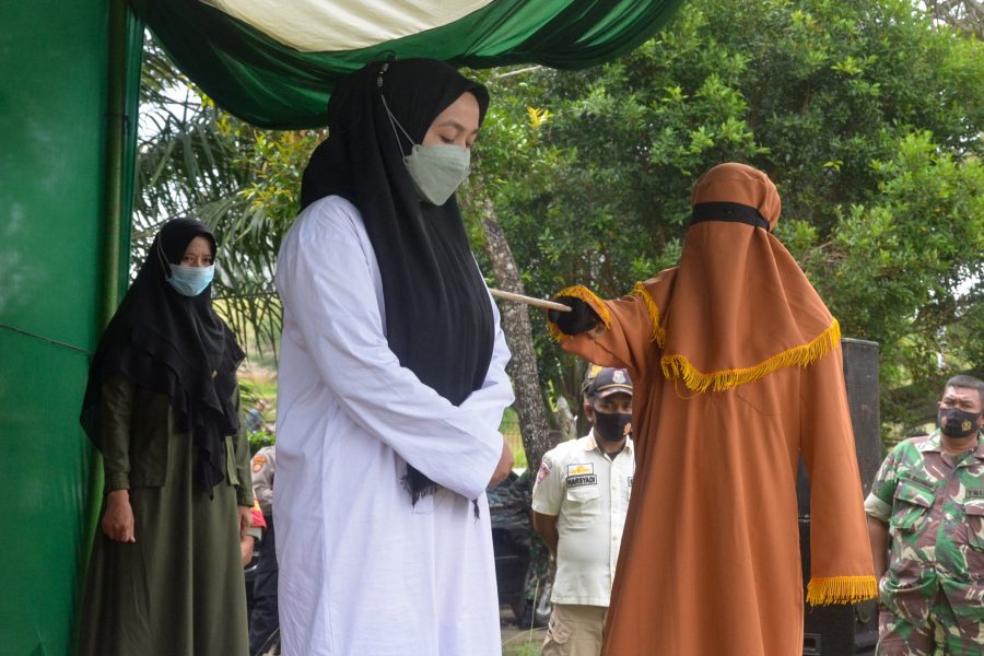 Indonesian woman charged with adultery publicly whipped 100 times, while man gets 15 lashes