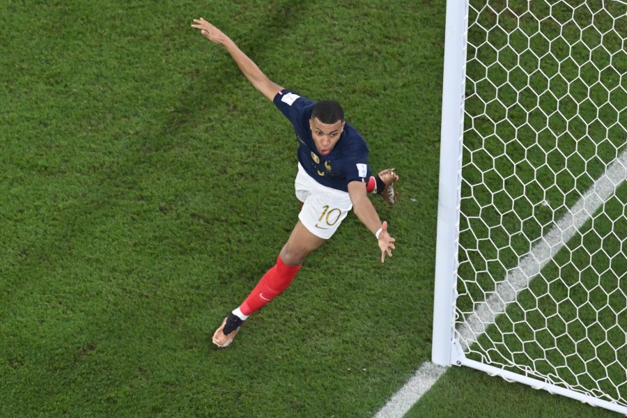 Mbappe double puts holders France into World Cup last 16